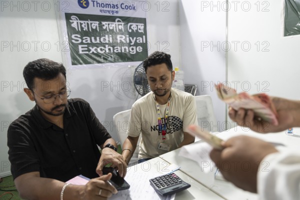 Hajj pilgrims cxchange money at Hajj Musafir Khana to before leaving to the airport, in Guwahati, India on 3 May 2025