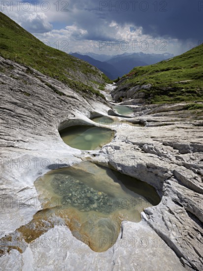 Glacier mill with glacier pots on the Trinser Alp Mora, Trin, Canton Graubünden, Switzerland, Europe