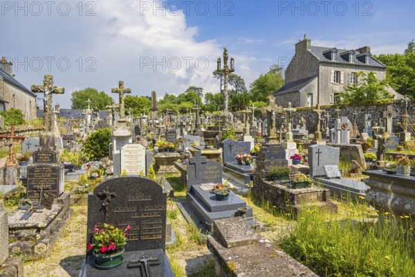 Tombstones in an old cemetery in a French old village, Locronan, Bretagne, France, Europe
