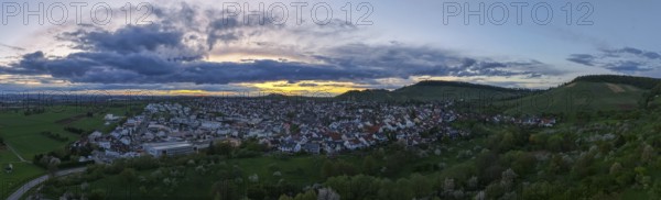 Urban panorama at dusk with dense clouds and rolling hills in the distance, Korb-Steinreinach, Rems Valley, Baden-Württemberg, Germany, Europe