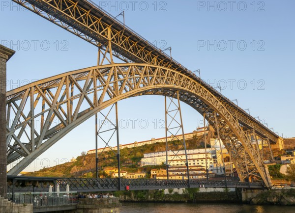 Golden hour at Dom Luis I Bridge crossing River Douro to Vila Nova de Gaia, Porto, Portugal, Europe 1886, Europe