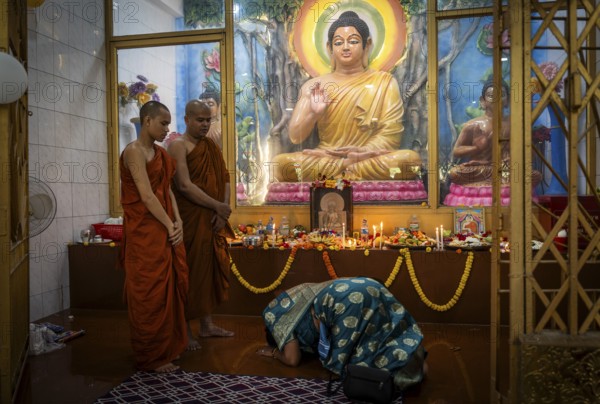 Devotees pray to Lord Buddha on the occasion of Buddha Purnima or Vesak Day that commemorates Gautam Buddha's birth anniversary, at a monastery in Assam, India on 12 May 2025
