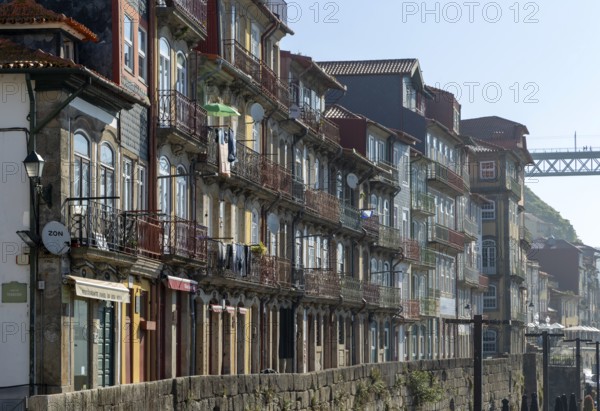 Historic buildings with balconies on waterfront of Ribeira district, city of Porto, Portugal, Europe