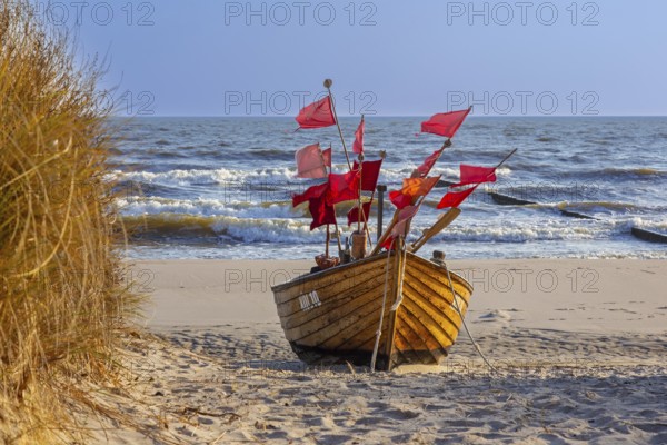 Traditional wooden fishing boat on the beach along the Baltic Sea at Stubbenfelde, Loddin on the island Usedom, Mecklenburg–Western Pomerania, Germany, Europe