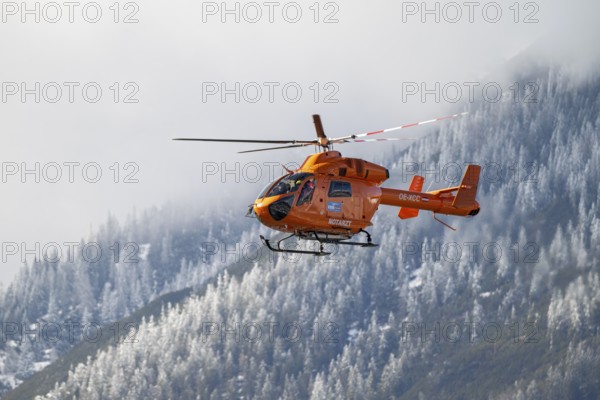 Rescue helicopter, emergency helicopter in flight, Schwaz, Tyrol, Austria, Europe