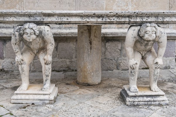 Table supported by stone sculptures, Island of Mary of the Rock, Gospa od Skrpjela, World Natural and Cultural Heritage Site, Bay of Kotor, Adriatic Sea, Mediterranean, Montenegro, Balkans, Europe