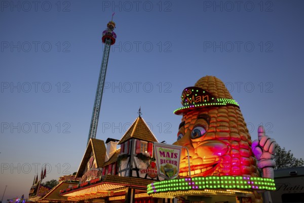 Corncob stall, Fortress Tower, freefall tower, amusement rides, rides, neon lights, Cannstatter Wasen, blue hour, funfair, spring festival, folk festival, Bad Cannstatt, Stuttgart, Baden-Württemberg, Germany, Europe