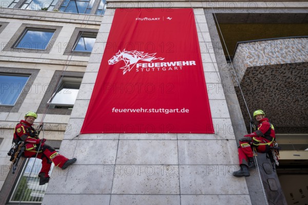 Men of the Stuttgart Fire Brigade at the presentation of the new design, design language of the Stuttgart Fire Brigade, professional fire brigade, banner, logo, Rössle, market square, Stuttgart, Baden-Württemberg, Germany, Europe