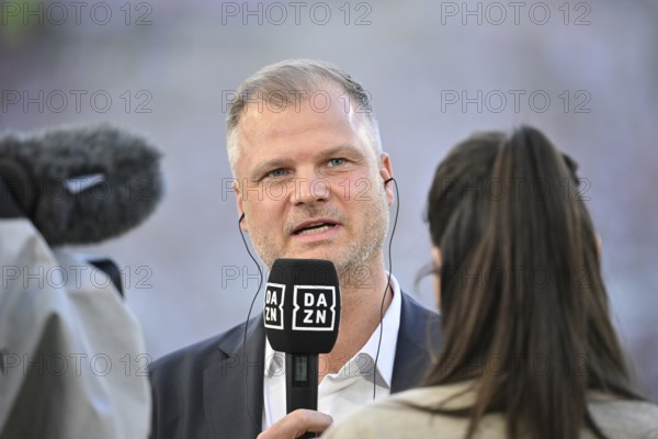 Chief Sports Officer Fabian Wohlgemuth VfB Stuttgart in front of TV camera in interview Microphone Logo with DAZN reporter Presenter Ann-Sophie Kimmel MHPArena, MHP Arena Stuttgart, Baden-Württemberg, Germany, Europe