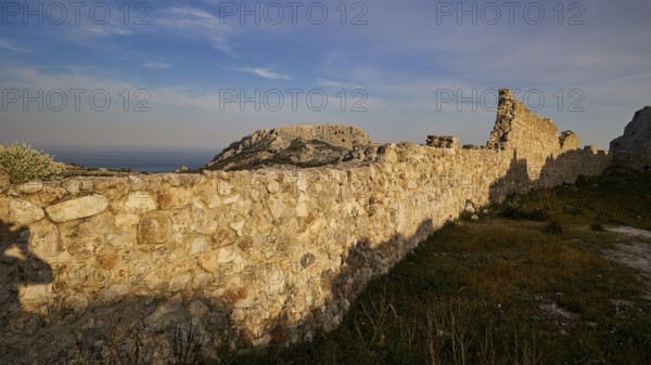 Long, stony wall of ruins stretching across the landscape under a blue sky, Archangelos, castle, place, Castle of Archangelos, Rhodes, Dodecanese, Greek Islands, Greece, Europe