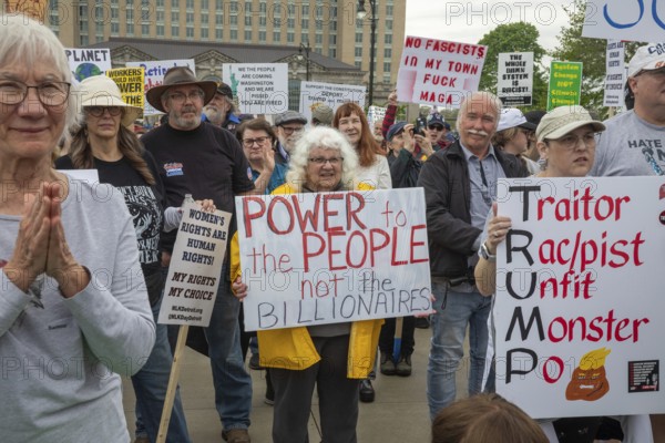 Detroit, Michigan - Labor organizations protest President Trump's 'war on working people' with a march and rally on May Day, the traditional International Workers Day