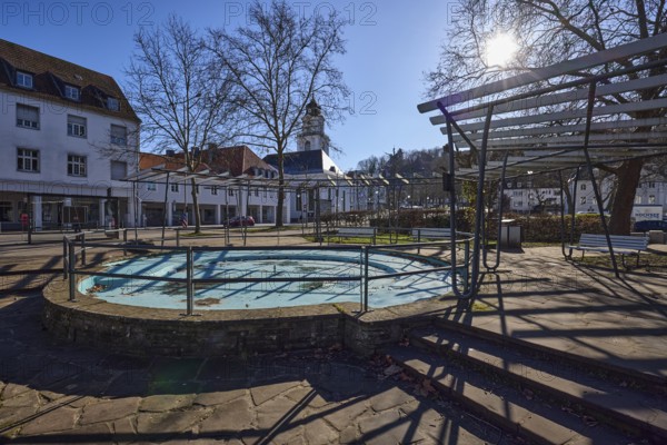 Stem plant, fountain, park, stainless steel railing, natural stone staircase, residential and commercial building, bare trees, backlight of the sun, shadow, blue sky, cloudless, Eisenbahnstraße, Saarbrücken, state capital, regional association Saarbrücken, Saarland, Germany, Europe