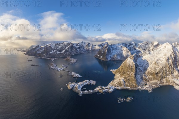 View of islands, fjord and mountains, snowy landscape, fishing villages Hamnøy, Sakrisøy and Reine, Reinefjord, Lofoten, Norway, Europe