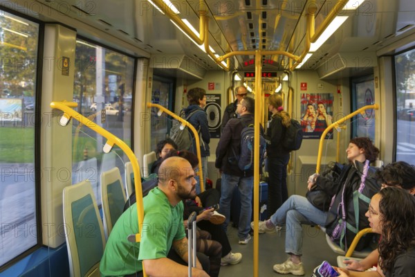 People on metro tram train public transport system, city of Porto, Portugal, Europe