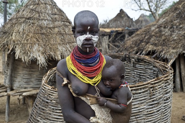 Portrait of a young mother and child from the Karo tribe, Omo valley, Ethiopia, Africa