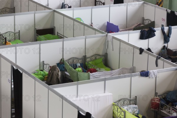 Temporary rooms with beds are set up in an emergency shelter for refugees on 9 December 2015 in a former hangar at Tempelhof Airport, Berlin, Berlin, Germany, Europe