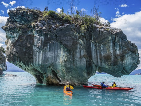 Paddling tourist in kajak at the marmor caves near Puerto Rio Tranquilo, a village at the Carretera Austral, Patagonia, Chile, South America
