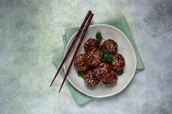 Tsukune, Japanese meatballs, minced chicken, fried on a skewer, with yakitori sauce, homemade, no people