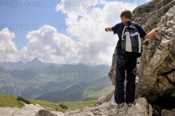 Ten-year-old boy hiking, Nebelhorn, Allgäu Alps, Bavaria, Germany, Europe