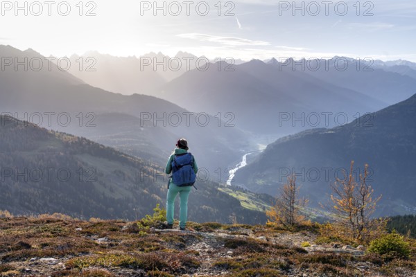 Hiker on the Venet, Upper Inn Valley in the morning light, view from Venet, Ötztal Alps, Tyrol, Austria, Europe