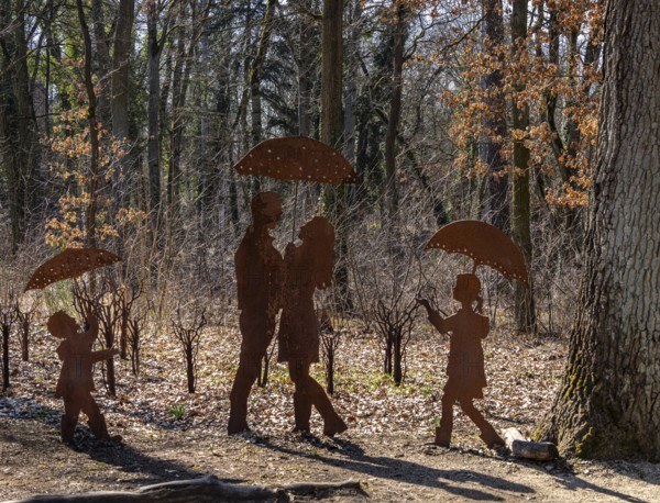 Rusty figures with umbrella, art installation on the grounds of the former tuberculosis sanatorium in Beelitz, Brandenburg, Germany, Europe