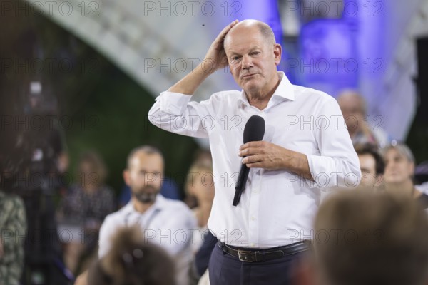 Olaf Scholz (Chancellor of the Federal Republic of Germany, SPD) surrounded by guests at the Chancellor's meeting at ufaFabrik in Berlin on 4 September 2024