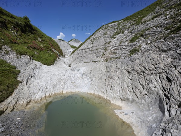 Glacier mill with glacier pots on the Trinser Alp Mora, Trin, Canton Graubünden, Switzerland, Europe