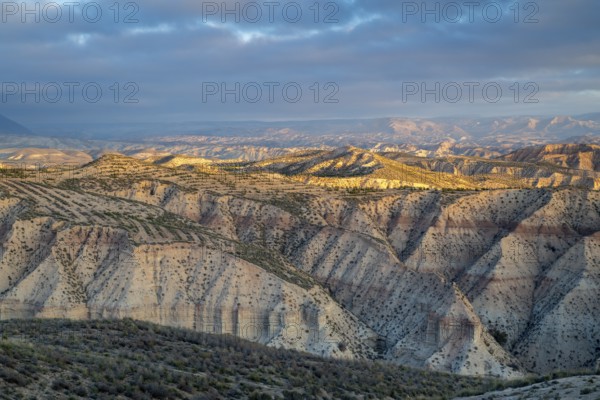 Sunrise, wide hilly desert landscape with dry vegetation, Gorafe desert, semi-desert, Granada, Andalusia, Spain, Europe