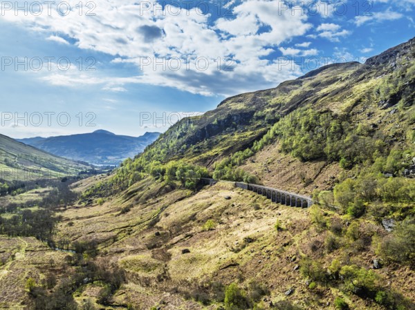 Mountains over Glen Ogle Viaduct from a drone, Road A85, Scotland, UK