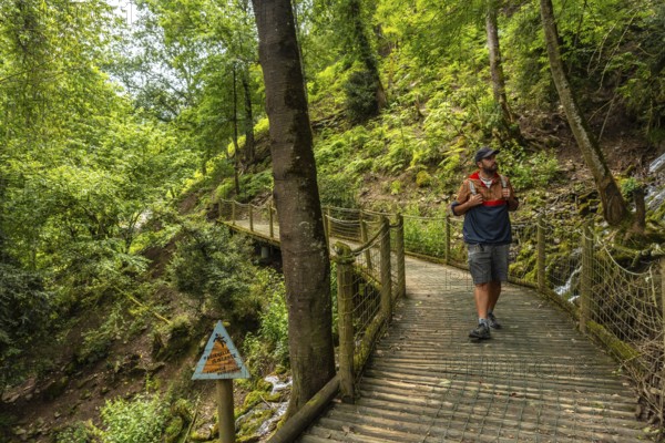 A male hiker on a mountain trail in the Borce commune of the French Pyrenees
