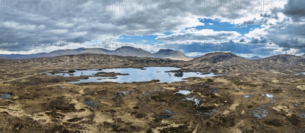 Panorama of Rannoch Moor from a drone over Loch Ba and Loch of the Armpit, A82 Highland Way, Argyll and Bute, West Highlands, Scotland, United Kingdom, Europe