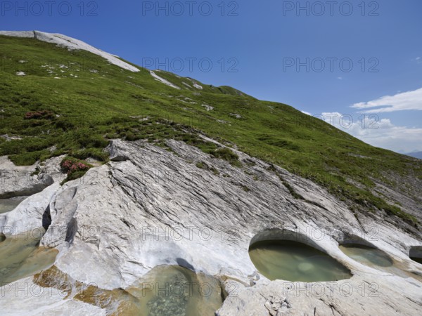Glacier mill with glacier pots on the Trinser Alp Mora, Trin, Canton Graubünden, Switzerland, Europe