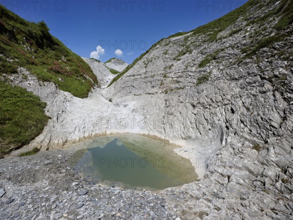 Glacier mill with glacier pots on the Trinser Alp Mora, Trin, Canton Graubünden, Switzerland, Europe