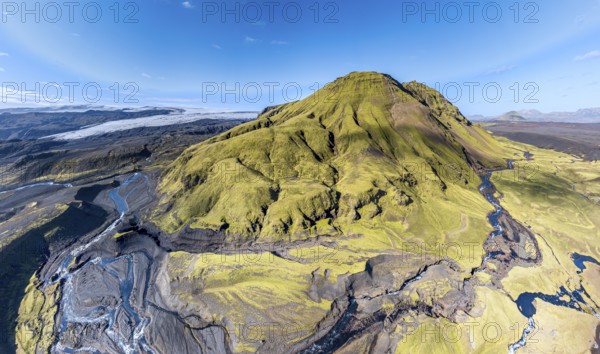 River along road F232 Öldufellsleid, slopes of Mt. Öldufell, moss-covered hill in black lava sand, aerial view, Iceland, Europe