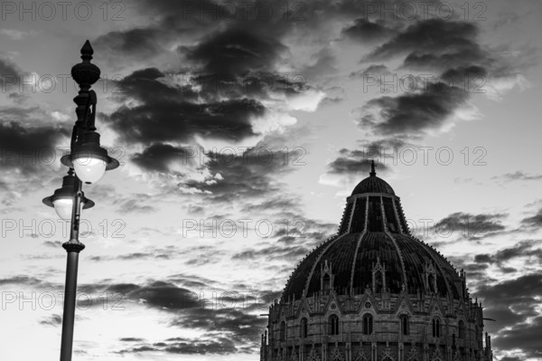 Baptistery under a street lamp at sunset, Pisa Tuscany, Italy, Europe