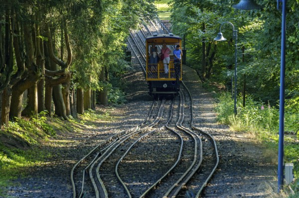 Historic funicular railway, rack and pinion funicular railway with water load on tracks, Nerobergbahn from 1888 travelling in the forest, technical cultural monument, Neroberg, Wiesbaden, Hesse, Germany, Europe