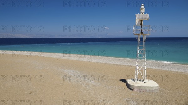 Northern tip of Rhodes, isolated lighthouse on sandy beach with wide sea view, harbour area, Rhodes town, Rhodes, Dodecanese, Greek Islands, Greece, Europe