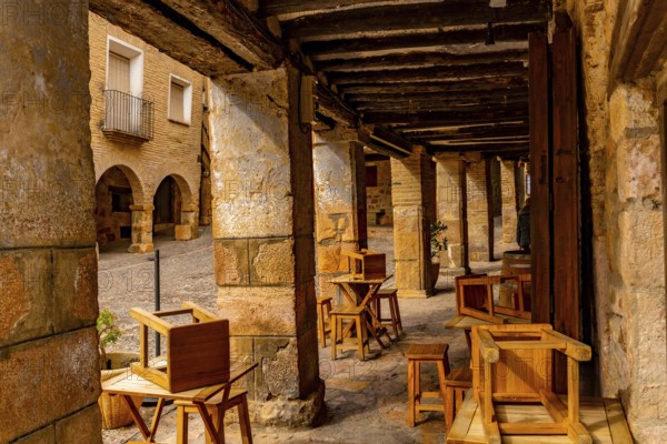 Picturesque Rafael Ayerbe square. Old Plaza Mayor of the Pyrenean town of Alquezar, Huesca, Spain, Europe