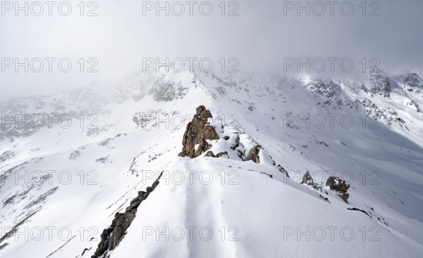 View of wintry mountain landscape on the ridge of Piz Laviner, Grisons Haute Route, Albula Alps, Rhaetian Alps, Grisons, Eastern Switzerland, Switzerland, Europe