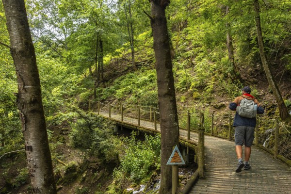 A male hiker on a mountain trail in the Borce commune of the French Pyrenees