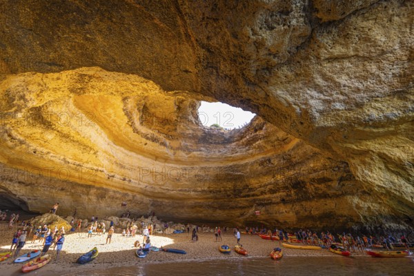 The world-famous Benagil Cave is only accessible from the sea and can be used at low tide. Numerous tourists from all over the world crowd into the nature-created cave in the Portuguese Algarve every day., Benagil, Faro, Portugal, Europe
