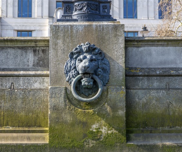 Bronze Lion head mooring ring on the Bazalgette Embankment, Westminster, London, England, UK