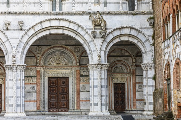 Arched entrance portals of the Cathedral of San Martino, historic city centre, Lucca, Tuscany, Italy, Europe