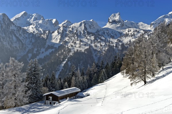 Winter view over the Loutse children's holiday home to the snow-covered Alpine peaks with Grand Chavalard, left, and Six Armaille, right, Ovronnaz, Valais, Switzerland, Europe