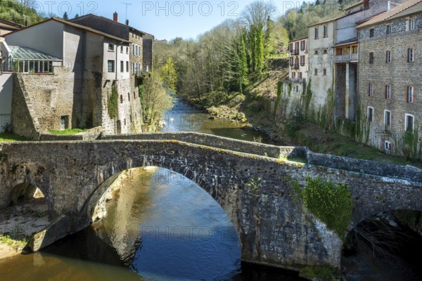 Olliergues village. Old bridge on river Dore. Natural regional park of Livradois Forez. Puy de Dome. Auvergne Rhone Alpes. France