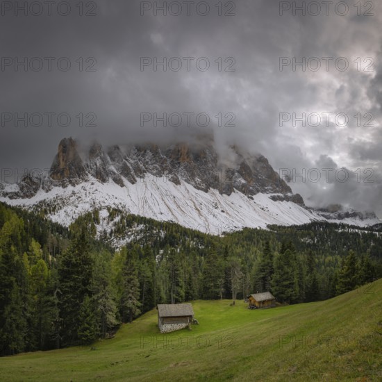 View of a part of the Geisler group in the foreground two mountain huts, Dolomites, snow, Puez-Geisler nature park Park, St. Magdalena, Villnöß, Funes, Villnößtal, South Tyrol, Italy, Europe