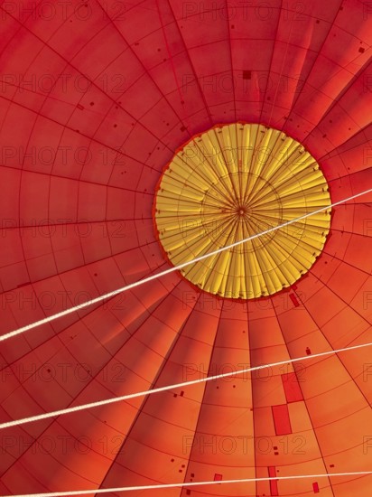 Hot air balloon inside view, top opens to release warm air before landing. Hot air balloon ride over the outback of Australia