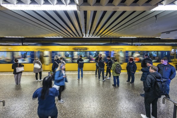 Charlottenplatz stop with passengers on the platform. Stuttgarter Straßenbahnen AG, SSB. Stuttgart, Baden-Württemberg, Germany, Europe