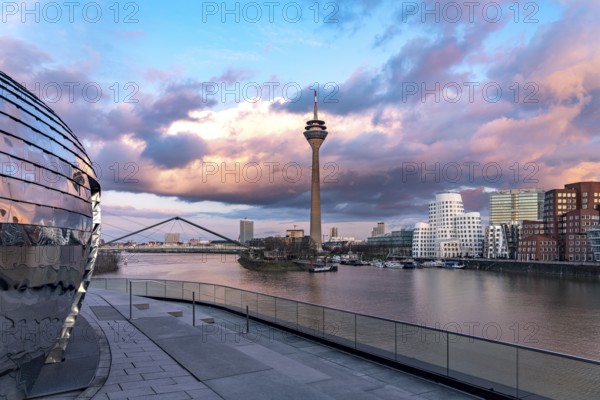 View from the terrace of the Hyatt Hotel of the Gehry buildings - Neuer Zollhof at the Media Harbour and the Rhine Tower in Düsseldorf, North Rhine-Westphalia, Germany, Europe