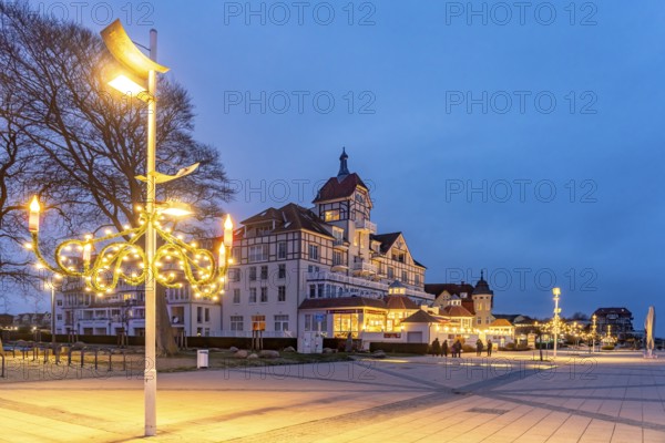 Baltic Sea promenade at Baltic Platz with Christmas lights in the Baltic seaside resort of Kühlungsborn at dusk, Mecklenburg-Vorpommern, Germany, Europe